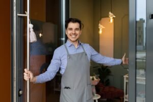 sole proprietor Glad to greet customers at the entrance to his store or cafe with a smile on his